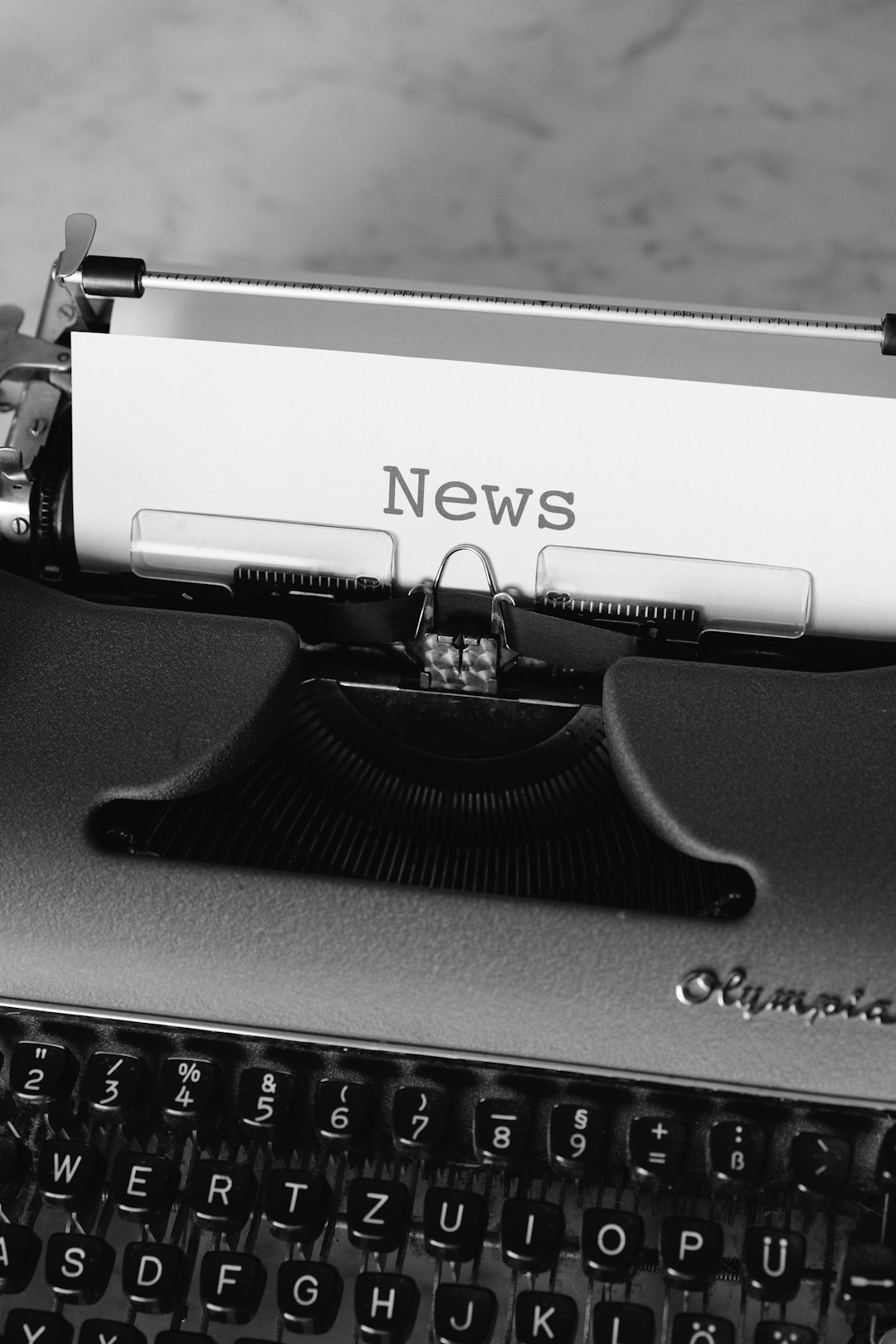 black-and-white-typewriter-on-black-table-ab4bjszotti